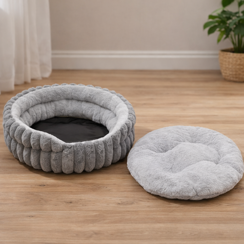 Rund hundeseng med myk plysj og omsluttende kanter for trygg hvile